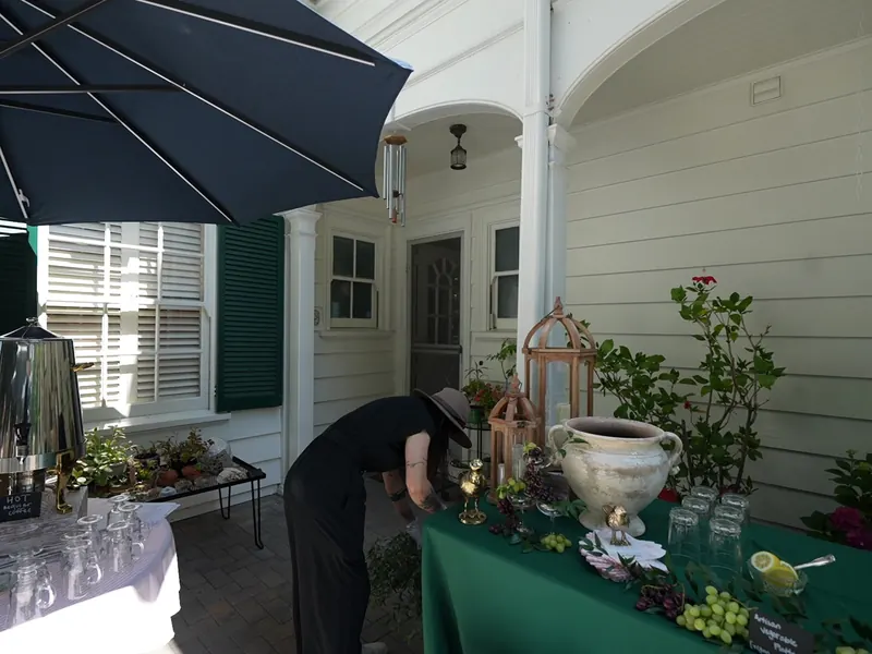 Staffed lunch buffet with an attendant serving a line of guests