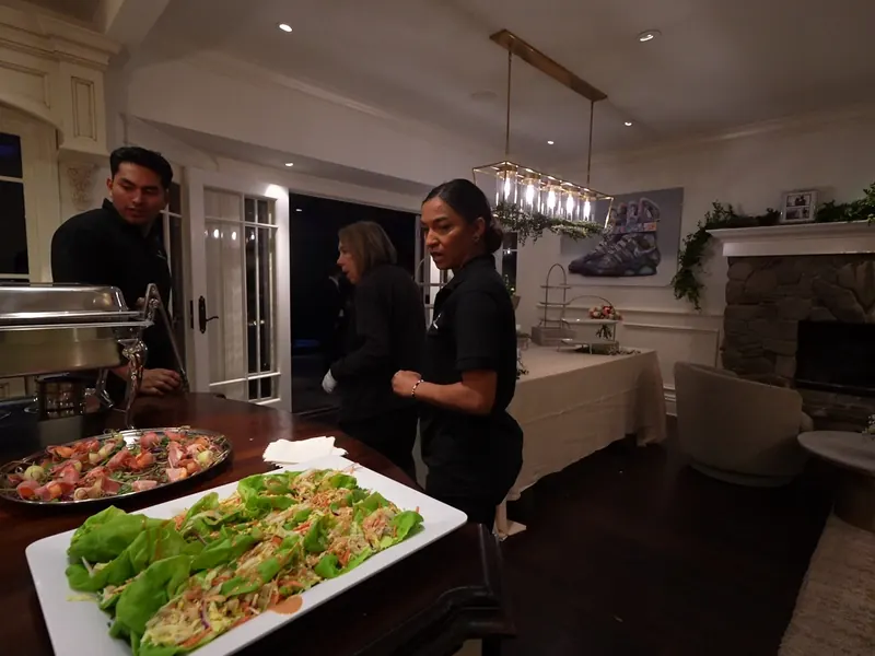 Casual buffet table staffed by an attendant at a family celebration