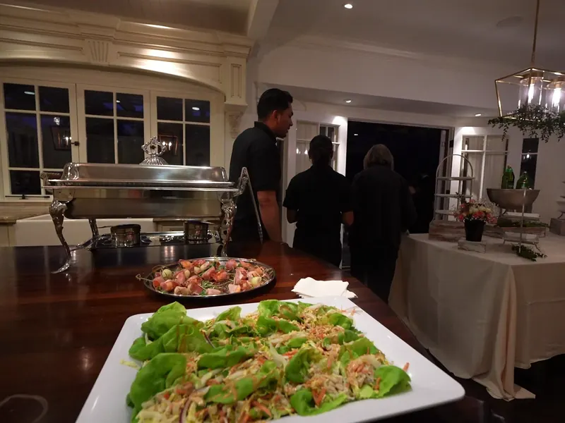 Server carrying a tray of hors d'oeuvres through a cocktail hour