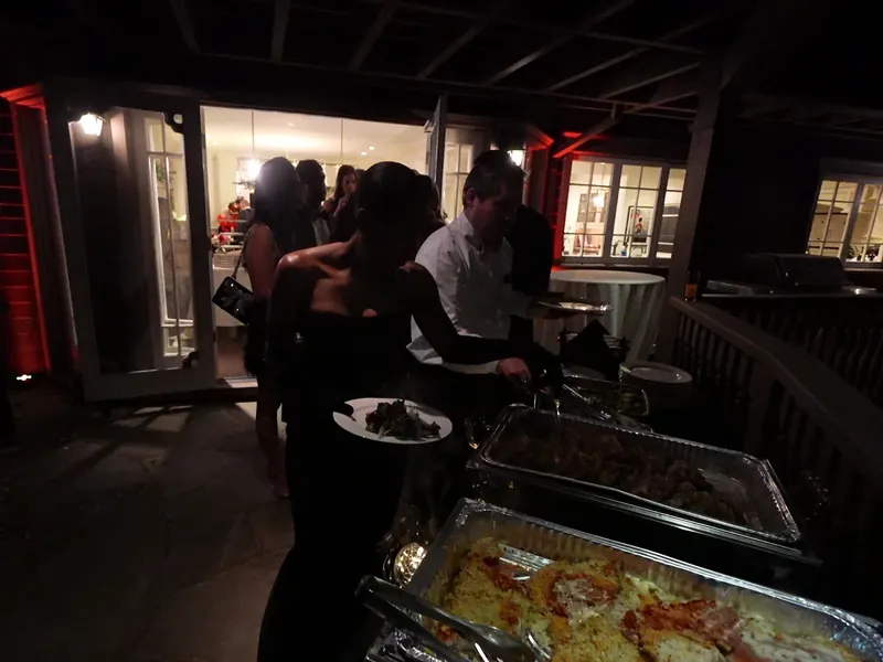 Dessert table with cake, strawberries, and sweets on a dressed table