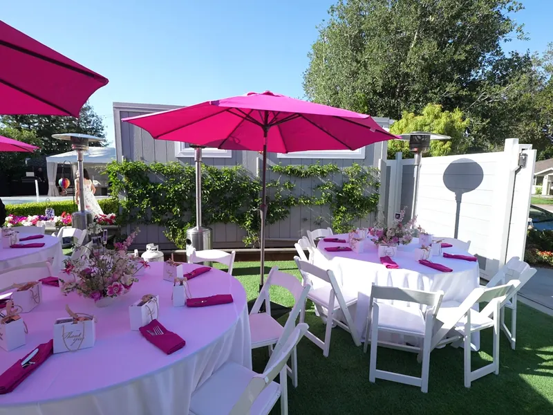 Outdoor table setup with pressed linens and place settings