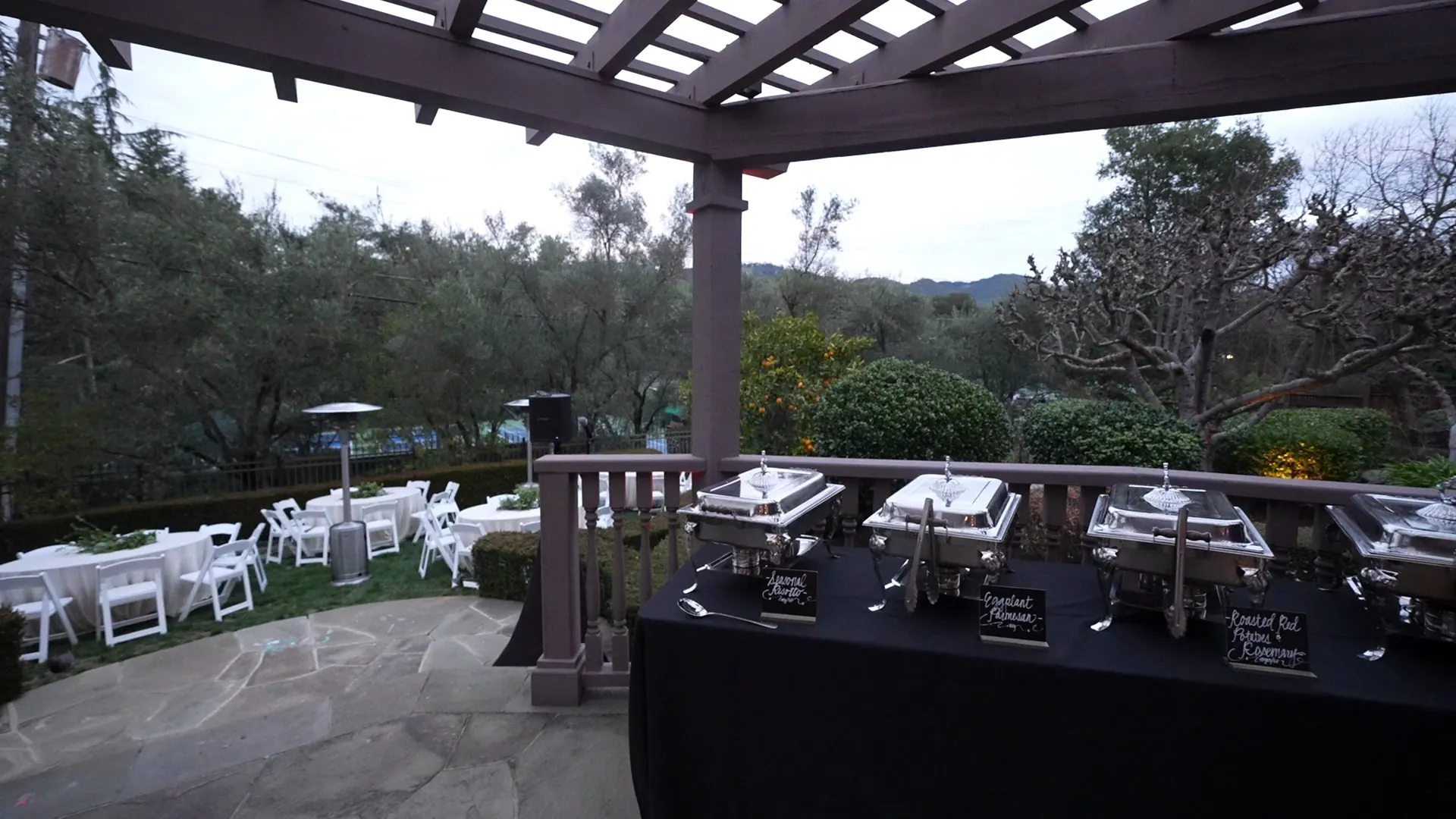 Mediterranean spread of skewers, salads, and warm flatbread on a long table