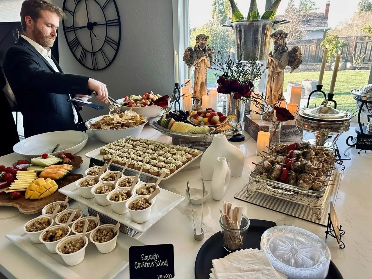 Elegant candlelit buffet of hot entrees, seasonal sides and salads set for a Concord evening event by Winslow's Catering Concord