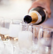 Pouring wine in a glass by full service catering east bay