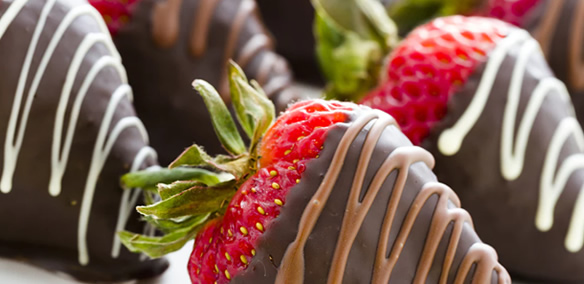 Strawberries coated with chocolate for birthday party catering menu