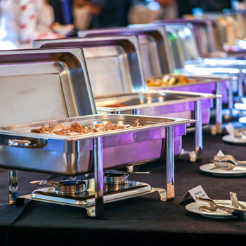 Food warmers setup in a buffet table for orinda catering